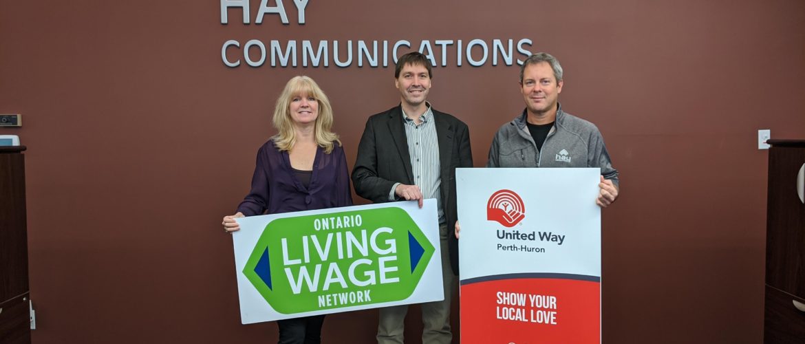Photograph celebrating Hay Communications Living Wage certification.