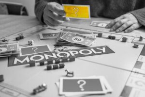 A person playing Monopoly.